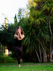 Woman doing yoga in park
