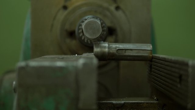 A metal appliance is spinning. This is an inportant equipment on some factory or plant. Close up.