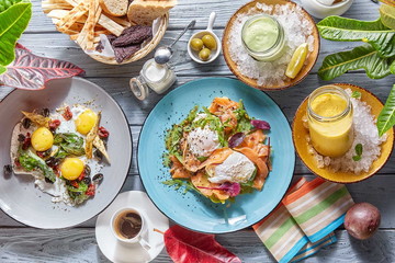 breakfast: fried eggs with olives and herbs, salmon with butter cream