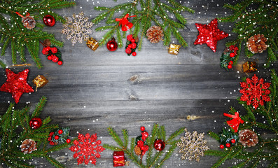Fototapeta na wymiar christmas background with decorations and snow on wooden board