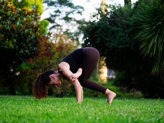 Woman doing yoga in park