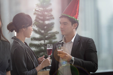 business people in hand hold champagne glass at party