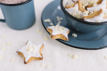 Star cookies in bowl with cocoa cup
