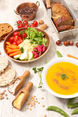 vegan food assortment, banana bread, soup and buddha bowl