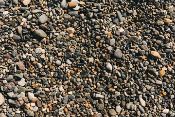 Many stones on the beach. Top view.