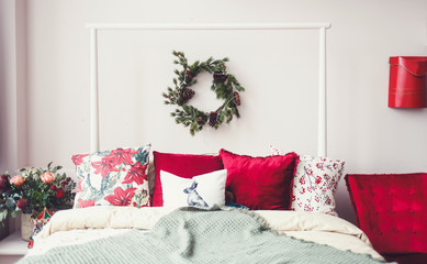 White decorated Christmas interior with bed