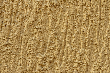 Sand color paint texture of old building wall with textured growths