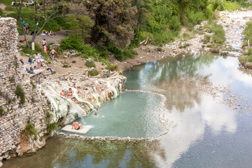 Tourist in hot springs Bagni di Petriolo - Monticiano in Italy.