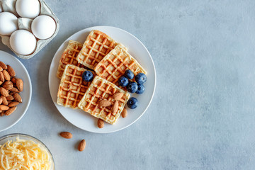Chaffles with blueberry. Egg and cheese waffles for breakfast. Keto diet. Cheese waffle.