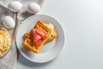 Chaffles with salmon. Egg and cheese waffles for breakfast. Keto diet. Cheese waffle.