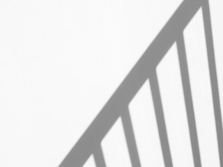 abstract shadow of railing stair on white wall background