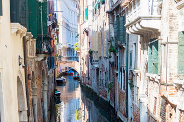 Narrow canal in old town of Venice - Italy