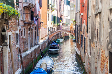 Fototapeta na wymiar Narrow canal in old town of Venice - Italy