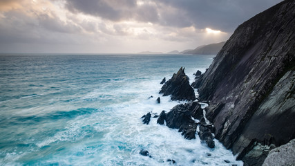 Fototapeta na wymiar coumeenoule harbour in the dingle peninsula in the south west coast of ireland during an autumn sunset on a stormy day