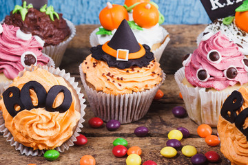 Halloween cupcakes with colored decorations