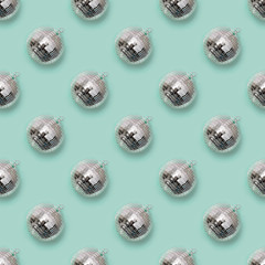 Seamless pattern of christmas silver disco ball on neo mint. Xmas background.