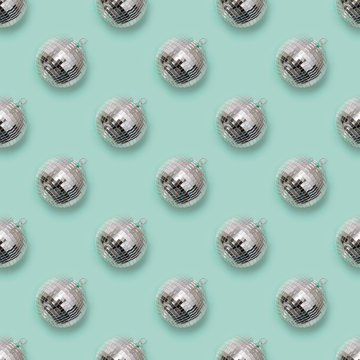Seamless pattern of christmas silver disco ball on neo mint. Xmas background.