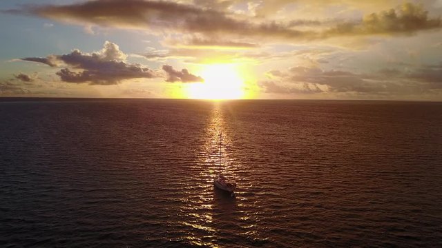 Boat at sunset in warm Caribbean sea