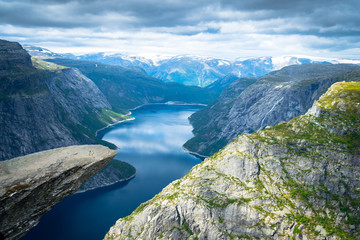 Naklejka na ściany i meble Trolltunga in Norway cliffs mountain and lake fiord