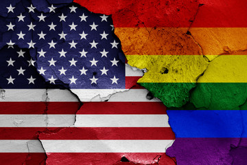 flags of USA and LGBT painted on cracked wall