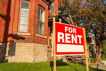 For rent sign posted in front of front porch