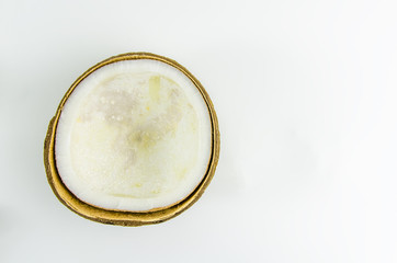 ugly food. old split coconut on a white background