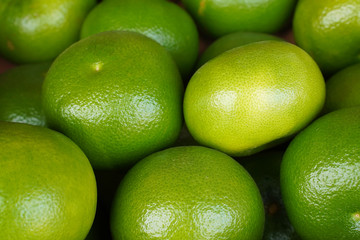 Ripe green grapefruit at the market. Food texture  
