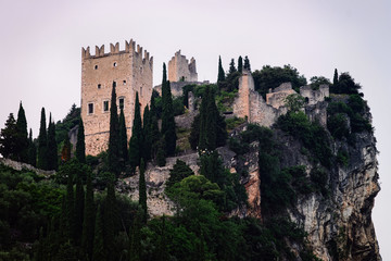 Landscape and Castello di Arco on rock Garda lake evening