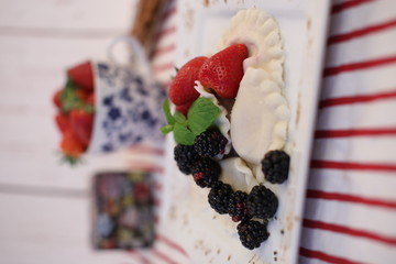 Dumplings with fruit. Tasty traditional food. A sweet dessert