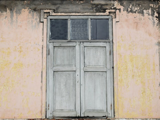 old wood window on dirty wall