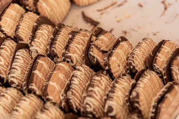 Sale of double cookies, chocolate and cream in street market