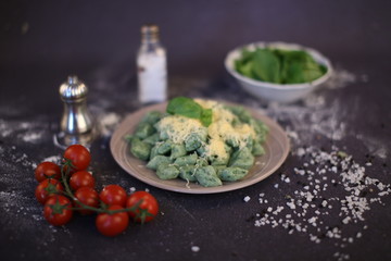Green spinach noodles. Composition on a dark background