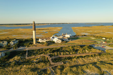 Aerial view of Oak Island Light house in North Carolina. The inter coastal waterway and marsh is in the background.