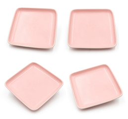 Set of pink square ceramic dishes isolated on white background