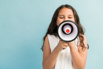 Female Child Trying To Silence Her Surrounding