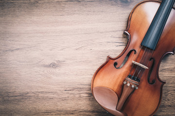 Fototapeta na wymiar classical violin on wooden floor. music background