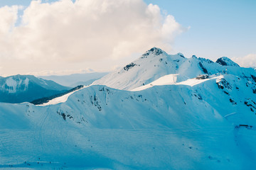 Fototapeta na wymiar Snowy peaks of Sochi