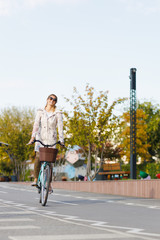 Young woman riding a bicycle in the city