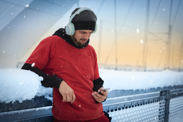Handsome man in sport clothes with phone