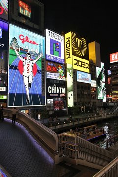 OSAKA, JAPAN - APRIL 24: Glico Man neon on April 24, 2012 in Osaka, Japan. Existing since 1935, Glico Man is one of most recognized neons worldwide.