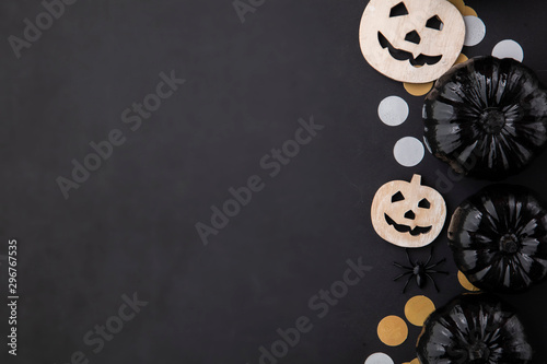 Black halloween lay flat composition with black pumpkins