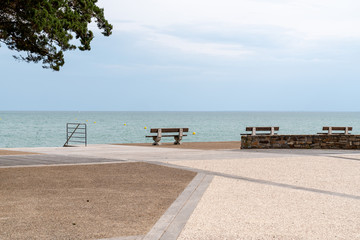 Benches on the boardwalk front of Clemenceau house atlantic beach in Saint Vincent sur jard in Vendée France