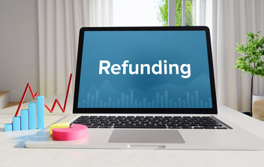 Refunding – Statistics/Business. Laptop in the office with term on the display. Finance/Economics.
