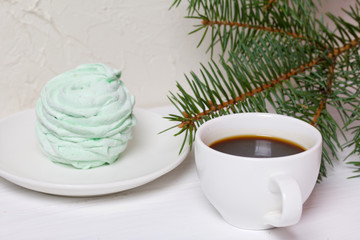 Desserts for winter parties. Sweets and spruce branch.