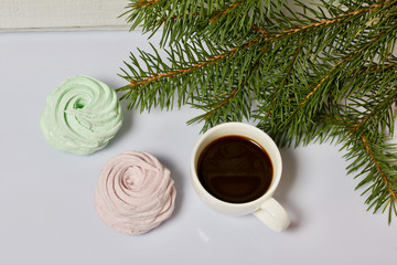 Desserts for winter parties. Sweets and spruce branch.