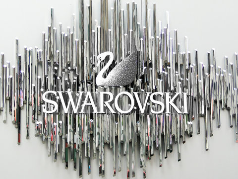 New York, June 1 2011: The Swarovski swan symbol and logo on a wall