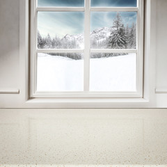 Table background of free space and blurred winter window 