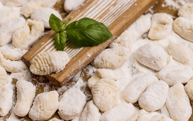 Cook handmade gnocchi on the table, Italian tradition