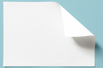 White sheet of paper, curled corner.