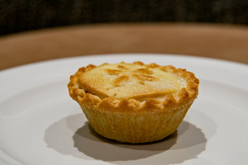Christmas mince pie. Fruit mince pies for festive, winter season.  Mince pie on white plate. Holidays concept. Treat for Santa Claus.Selective focus.